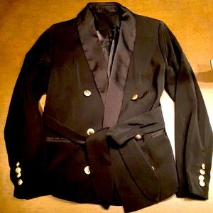 Regal, lion head button, tie-waist tuxedo jacket.